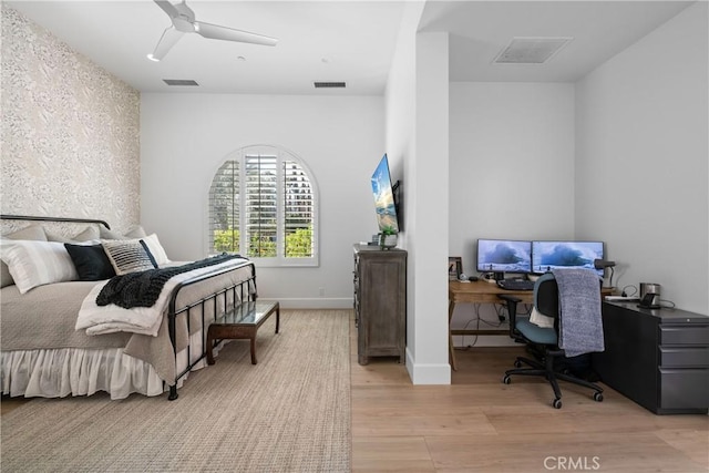 bedroom featuring light hardwood / wood-style floors and ceiling fan