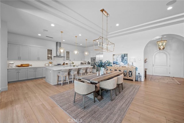 dining area featuring sink and light hardwood / wood-style flooring