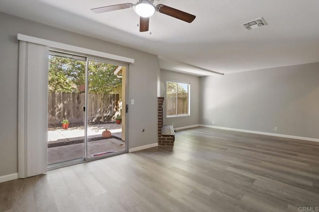 unfurnished room featuring hardwood / wood-style floors and ceiling fan