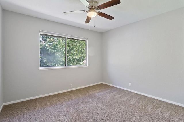 unfurnished room with carpet and ceiling fan