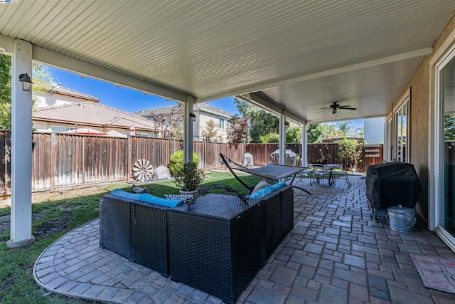 view of patio / terrace with ceiling fan and a grill