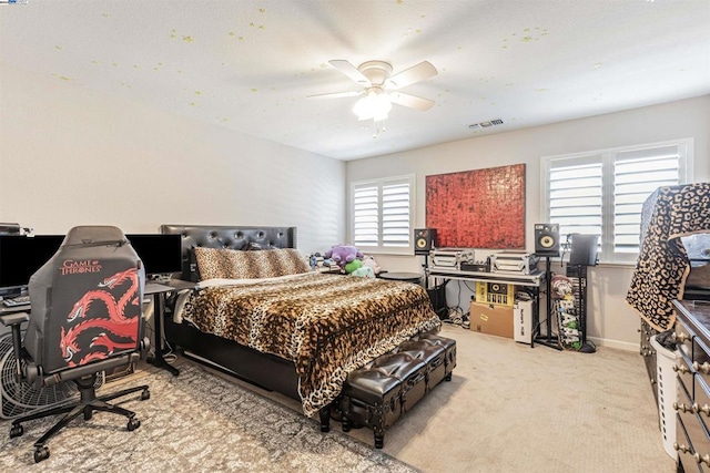 carpeted bedroom with ceiling fan