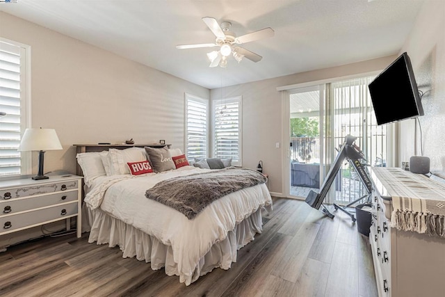 bedroom with access to outside, ceiling fan, and hardwood / wood-style floors