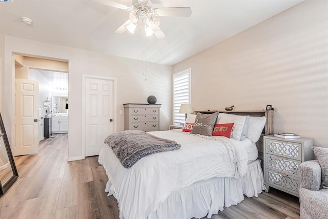 bedroom featuring ceiling fan, light wood-type flooring, and ensuite bathroom