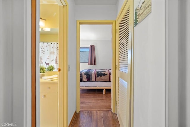 hallway with wood-type flooring