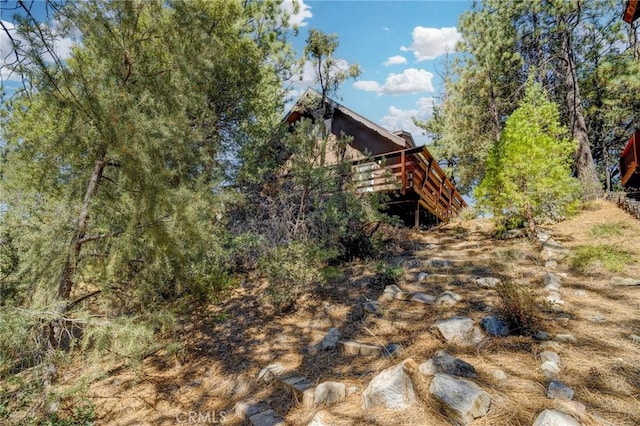 view of yard featuring a wooden deck