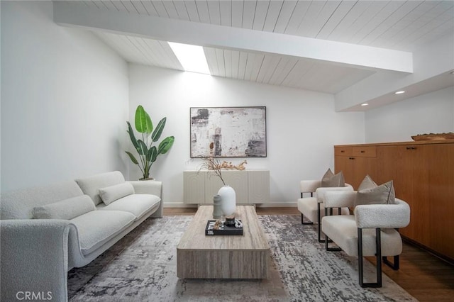 living room featuring vaulted ceiling with beams and dark wood-type flooring