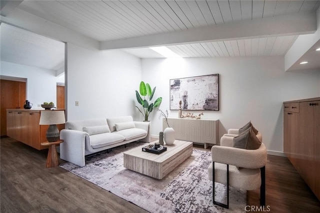 living room featuring lofted ceiling with beams and dark hardwood / wood-style flooring