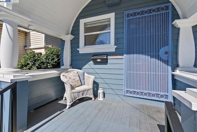 wooden deck featuring covered porch