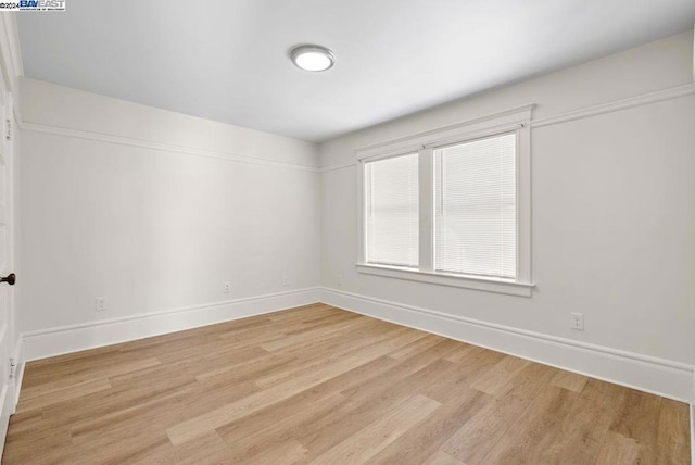 spare room featuring light wood-type flooring