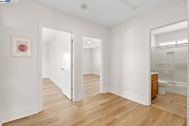 hallway featuring light hardwood / wood-style flooring