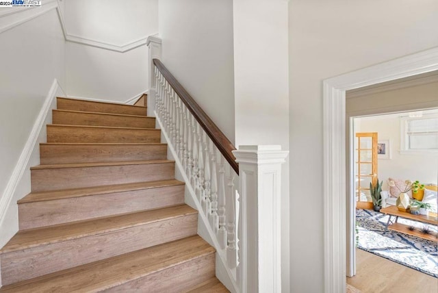 staircase featuring hardwood / wood-style floors