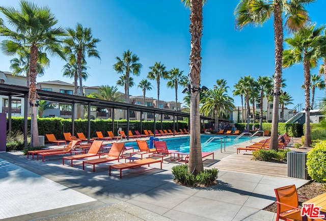 view of swimming pool with a patio