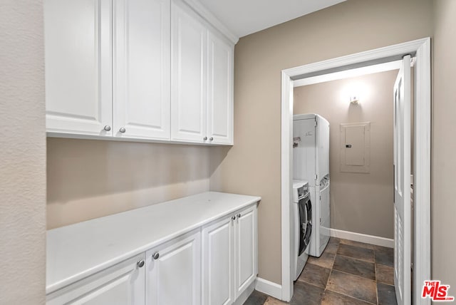 laundry area with cabinets, independent washer and dryer, and electric panel