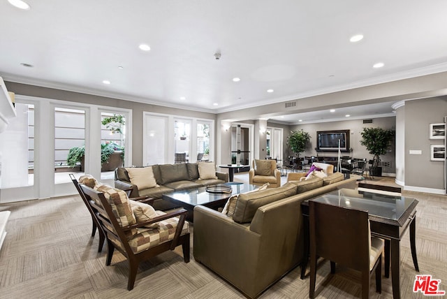 living room featuring crown molding