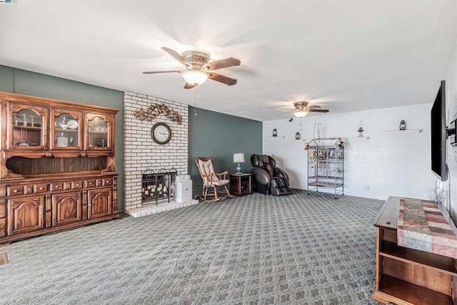 living room with carpet, ceiling fan, and a fireplace