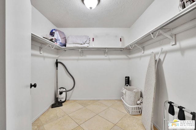 walk in closet featuring light tile patterned floors