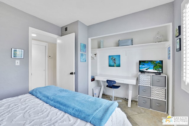 bedroom with light tile patterned flooring