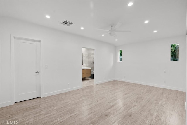 unfurnished room with ceiling fan and light hardwood / wood-style flooring