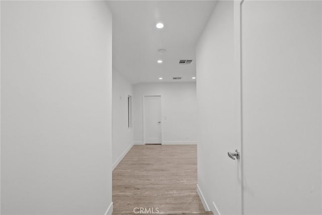 hall with light hardwood / wood-style floors