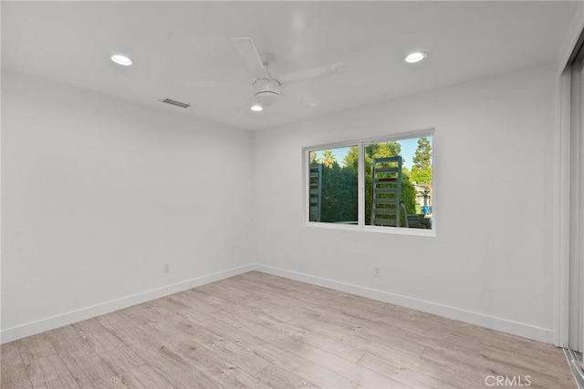 unfurnished room with ceiling fan and light hardwood / wood-style floors