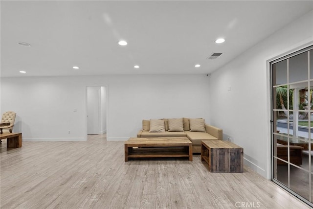 living room with light hardwood / wood-style flooring