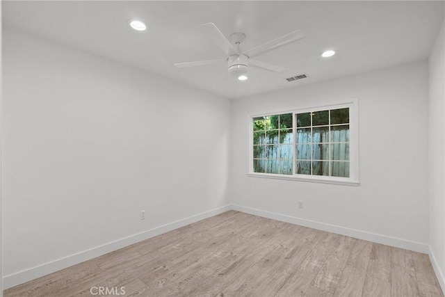 unfurnished room featuring light hardwood / wood-style floors and ceiling fan