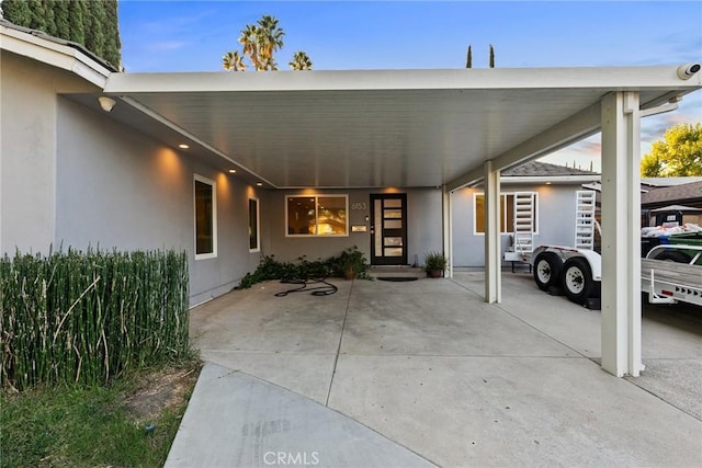 exterior space with a carport