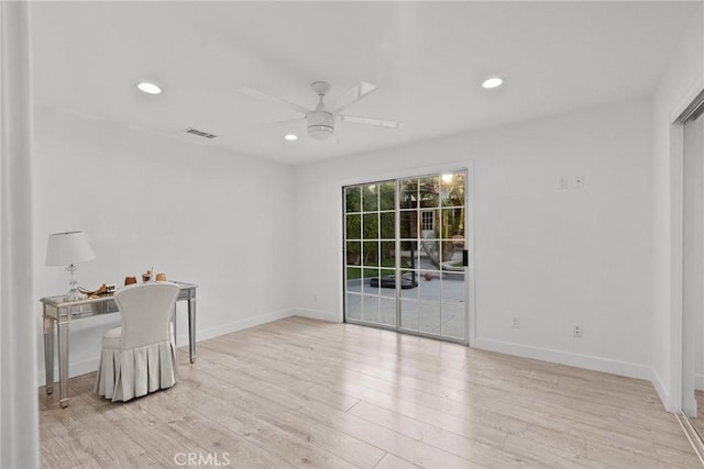 unfurnished room featuring light hardwood / wood-style floors and ceiling fan