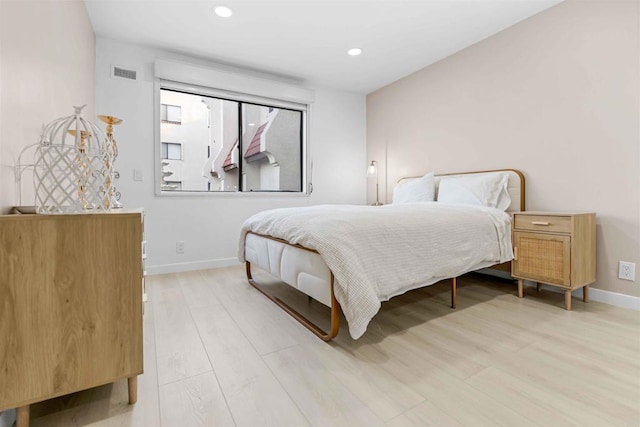 bedroom with light hardwood / wood-style flooring