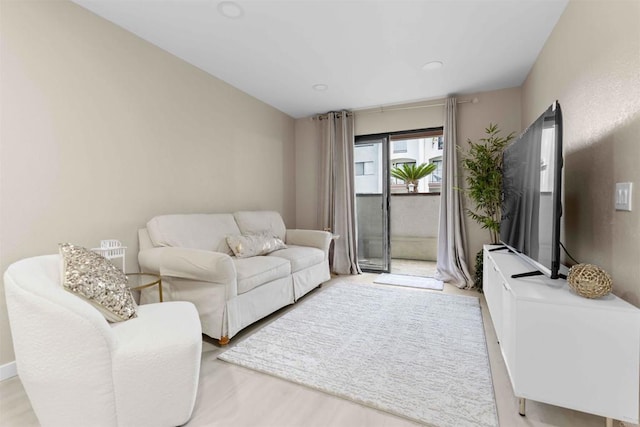 living room with light hardwood / wood-style flooring