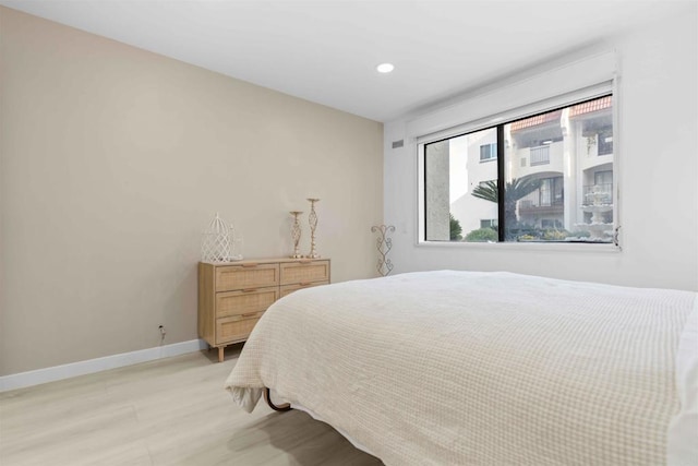 bedroom with light hardwood / wood-style floors