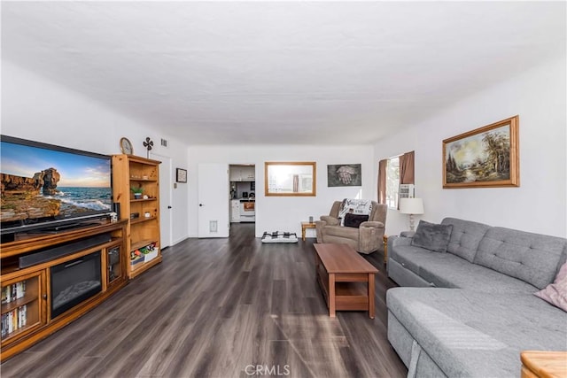 living room featuring dark hardwood / wood-style flooring