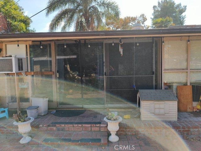 entrance to property with a patio area