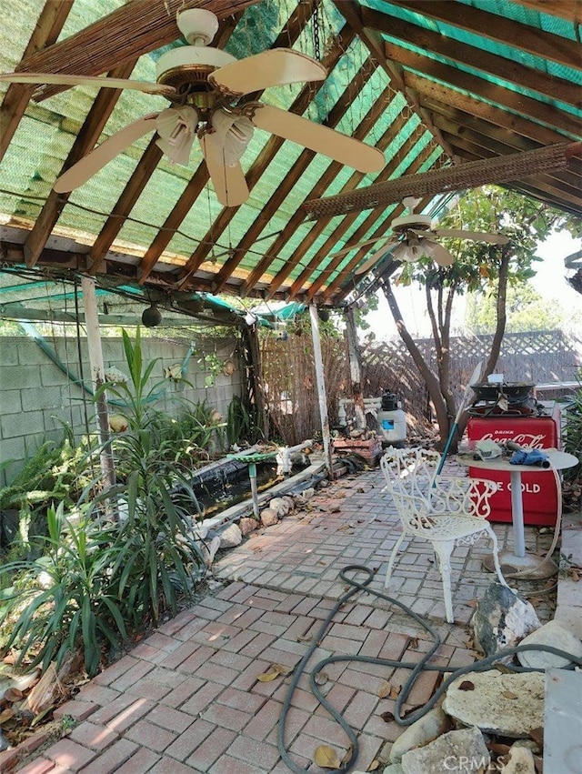 view of patio featuring ceiling fan