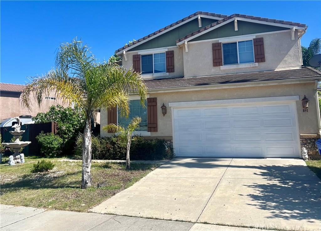 891 Sycamore Canyon Rd, Paso Robles, CA 93446 - view of front of home with stucco siding, an attached garage, a tiled roof, and concrete driveway