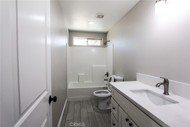 full bathroom with shower / washtub combination, wood-type flooring, vanity, and toilet