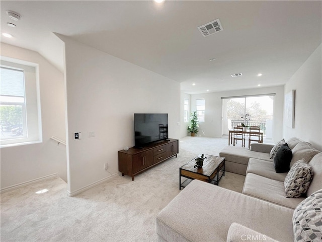 carpeted living room with a healthy amount of sunlight