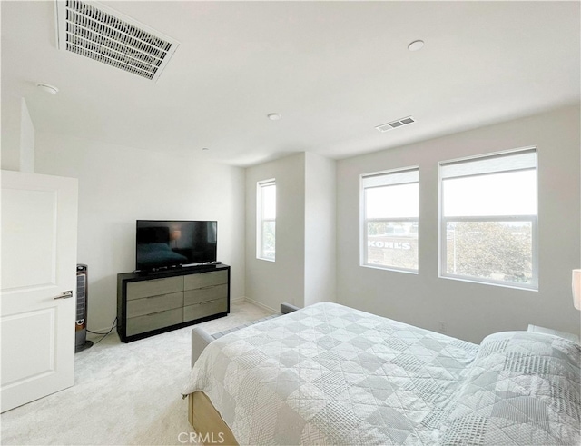 bedroom featuring light colored carpet