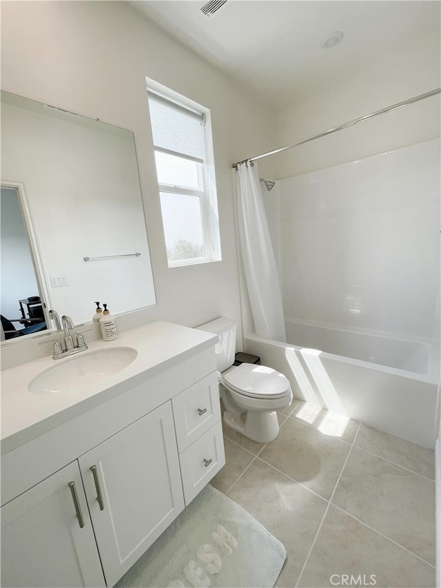 full bathroom featuring shower / bathtub combination with curtain, tile patterned floors, vanity, and toilet