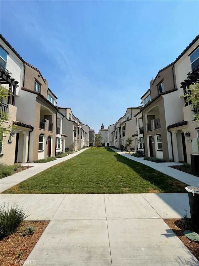 view of community featuring a yard