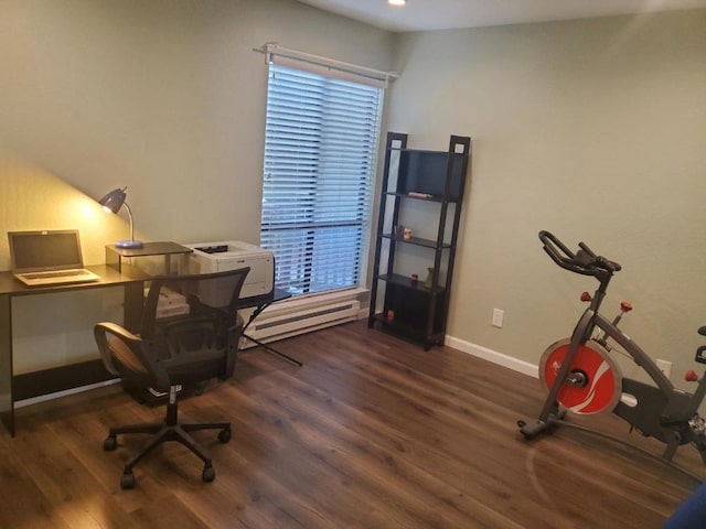 office area with a baseboard radiator and dark hardwood / wood-style flooring