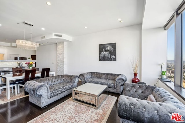 living room with dark hardwood / wood-style flooring