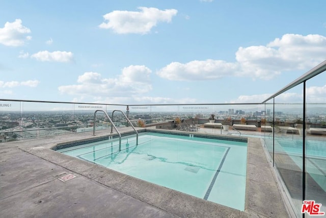 view of swimming pool featuring a patio area