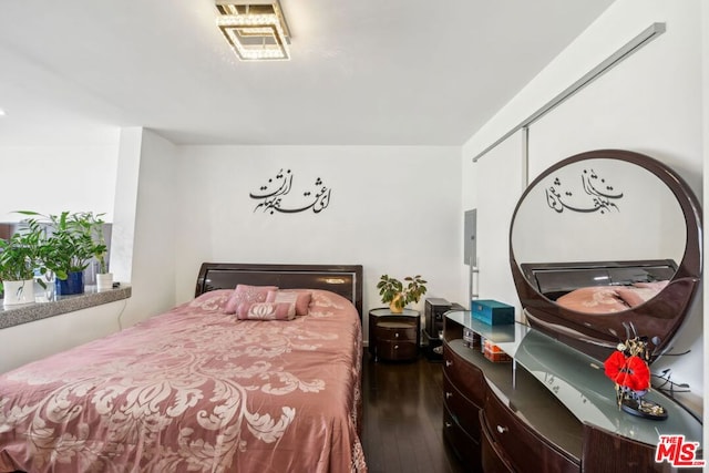 bedroom featuring dark hardwood / wood-style floors