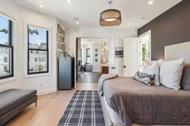 bedroom with light hardwood / wood-style flooring