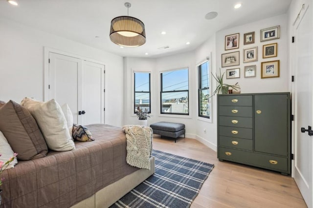 bedroom with light hardwood / wood-style flooring