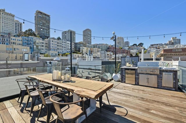 deck featuring a grill and exterior kitchen