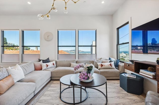 living room featuring plenty of natural light and a chandelier