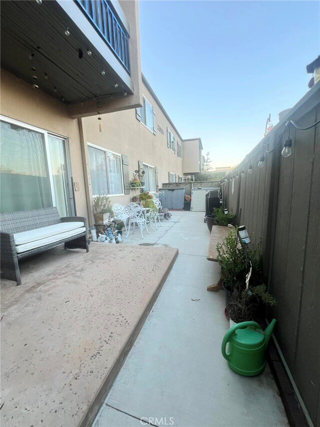 view of patio / terrace with a hot tub